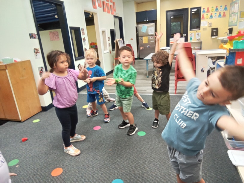 Happy children learning together at Sunshine Prep Academy